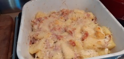 Gnocchi with bacon bits in creamy sauce